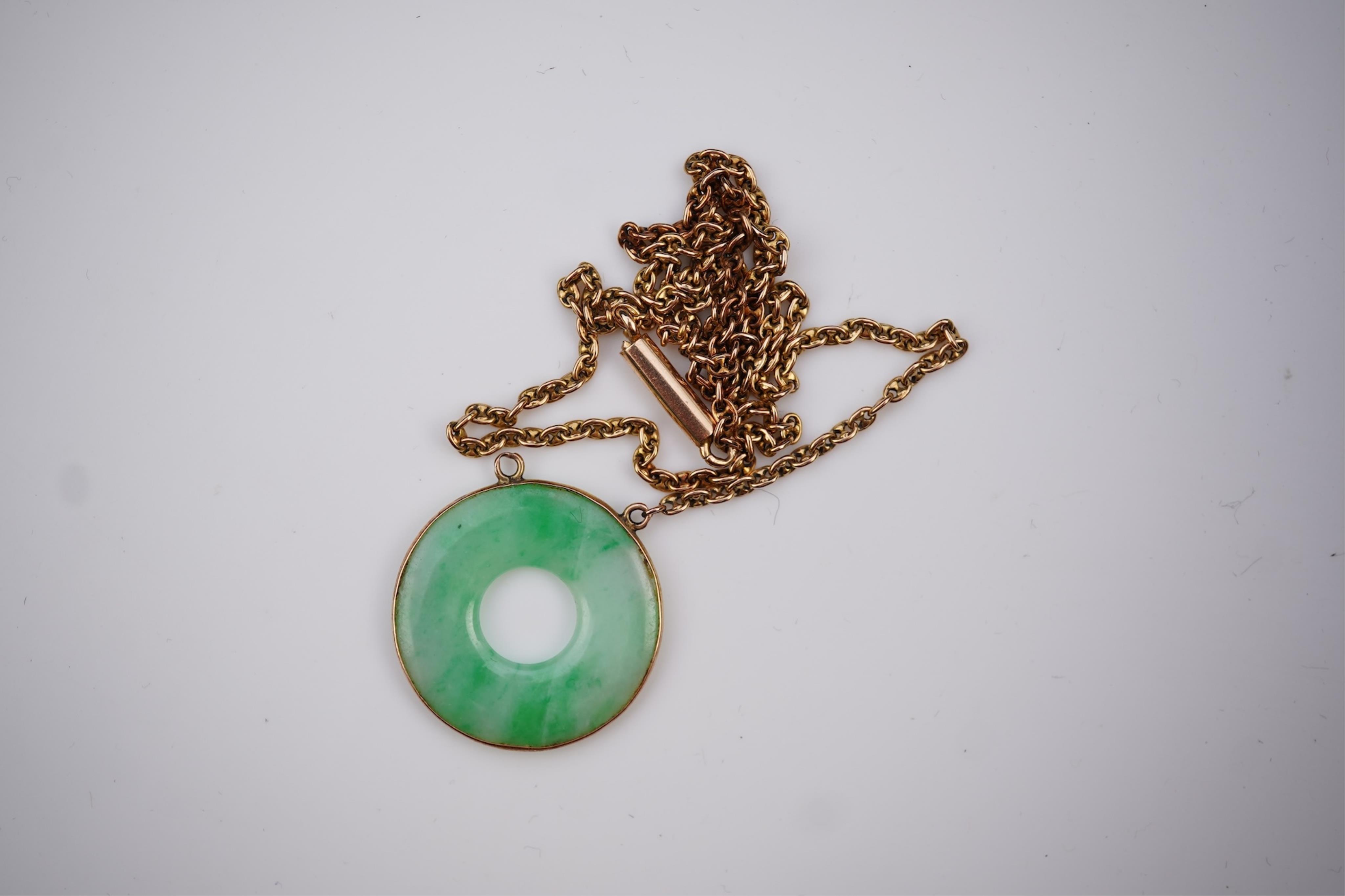 Two jadeite pendants